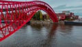 Aerial drone view of modern footbridge Python Bridge at Eastern Docklands neighborhood of Amsterdam Netherlands Royalty Free Stock Photo