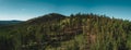 Aerial drone view of mountain peak with forest on the top, Russia Royalty Free Stock Photo