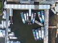 Aerial drone view of Muara Angke Beach with wooden boats leaning beside the pier. With noise cloud after rain. Jakarta, Indonesia Royalty Free Stock Photo