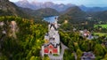 Aerial drone view Neuschwanstein castle on Alps background in vicinity of Munich, Bavaria, Germany, Europe. Autumn