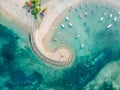 Aerial drone view of ocean, boats, beach, shore In Sanur Beach, Bali, Indonesia with with Traditional Balinese Fishing Boats