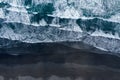 Aerial drone view of ocean waves washing black sand beach, Iceland Royalty Free Stock Photo