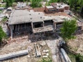 Aerial drone view of old demolished industrial building. Pile of concrete and brick rubbish, debris, rubble and waste of