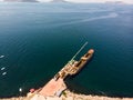 Aerial Drone View of Old Garbage Scow Vessel Ship with Crane in the Port. Royalty Free Stock Photo