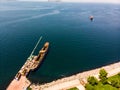 Aerial Drone View of Old Garbage Scow Vessel Ship with Crane in the Port. Royalty Free Stock Photo
