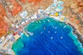 Aerial drone view of Old port Amoudi bay in Oia village with fishing boats. Santorini island in Aegean sea, Greece Royalty Free Stock Photo