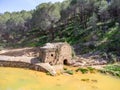 Aerial drone view of old watermill in the shore of Odiel river in the hiking route of the water mills along the