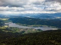 Aerial drone view on Ossiacher Lake in Carinthia, Austria on a summer day with great cloudscape and Lake Woerthersee in Royalty Free Stock Photo