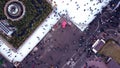 Aerial Drone View Over many people skating on an open-air ice rink in winter.