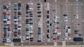 Aerial drone view of parking lot with many cars from above, city transportation Royalty Free Stock Photo