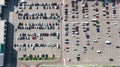 Aerial drone view of parking lot with many cars near shopping mall from above, city transportation Royalty Free Stock Photo