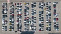 Aerial drone view of parking lot with many cars near shopping mall from above, city transportation Royalty Free Stock Photo