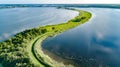 Aerial drone view of path on dam in polder water from above, landscape and nature of North Holland, Netherlands
