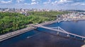 Aerial drone view of pedestrian Park bridge, Dnieper river and Kyiv cityscape, city of Kiev, Ukraine