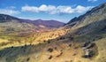 Aerial drone view of Piatra Secuiului mountain and Rimetea village in Transylvania, Romania