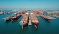 Aerial drone view port with shipyard. Container ships, cargo vessels docked, loading, unloading in open sea. Blue sky background. Royalty Free Stock Photo