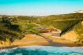 Aerial drone view of Praia de Ribeira d'Ilhas beach in Ericeira, Portugal. The Ericeira world surfing reserve Royalty Free Stock Photo