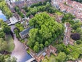 Aerial drone view of the Princely Beguinage Ten Wijngaerde, minnewater park and bridge. It is the only preserved beguinage in the