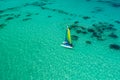 Aerial drone view of sailing sailboat surf or catamaran in turquoise water of Caribbean sea near Punta Cana beach Royalty Free Stock Photo