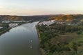 Aerial drone view of Sanlucar de Guadiana in Spain and Alcoutim in Portugal with sail boats on Guadiana river Royalty Free Stock Photo