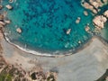 Aerial  drone view of scenic amazing  beach cove, rocks cliff a boat and sandy beach - cala tinnari, costa paradiso - sardinia ita Royalty Free Stock Photo