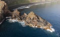 aerial drone view of the sea, a cliff and the beach in the background Royalty Free Stock Photo