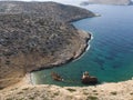 Aerial drone view of Shipwreck Olympia boat in Amorgos island during summer holidays, at the coastal rocky area, people on the Royalty Free Stock Photo