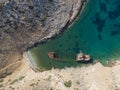 Aerial drone view of Shipwreck Olympia boat in Amorgos island during summer holidays, at the coastal rocky area, people on the Royalty Free Stock Photo