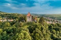 Aerial drone view of Slimnic Fortress Stolzenburg, located on a Burgbasch hill in  Sibiu region, Romania Royalty Free Stock Photo