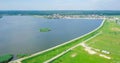 Aerial Drone View Of Small Green Island Lake On Blue Sky