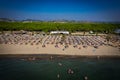 Aerial drone view of Spille beach in Albania with pine forest