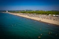 Aerial drone view of Spille beach in Albania with pine forest