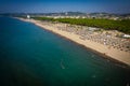 Aerial drone view of Spille beach in Albania with pine forest