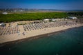 Aerial drone view of Spille beach in Albania with pine forest