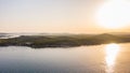 Aerial drone view of sunset over Kornati islands near the Sibenik city, Croatia. Water bay with boats ans soft sun light Royalty Free Stock Photo