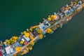 Aerial drone view of tiny fishing island on Lake Kavicsos near Budapest. The island is full with fishing huts, piers and cabins.