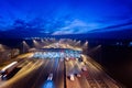 Aerial drone view on toll collection point on motorway at night.