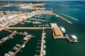 Aerial drone view of tourists at a jetty pier leaving from a ferry boat on the Ria Formosa, Algarve region, Portugal Royalty Free Stock Photo