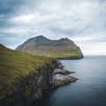 Aerial Drone view of Trollanes Village and Beautiful Waterfall, Kalsoy, Faroe Islands, Denmark. Nordic Islands