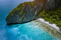 Aerial drone view of tropical beach with banca boats on Entalula Island. Karst limestone rocky mountains surrouns blue Royalty Free Stock Photo