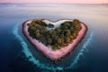 aerial drone view of tropical paradise island in heart shape on pink sunrise