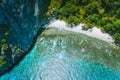 Aerial drone view of uninhabited tropical island with rugged lime stone mountains, rainforest jungle, sandy beach with Royalty Free Stock Photo