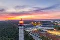 Aerial drone view of Vila Real de Santo Antonio city, lighthouse farol and stadium in Portugal, at sunset