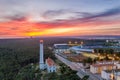 Aerial drone view of Vila Real de Santo Antonio city, lighthouse farol and stadium in Portugal, at sunset