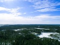 Aerial drone view of a winter landscape. Snow covered forest and lakes from the top. Sunrise in nature from a birds eye view. Royalty Free Stock Photo