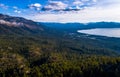 Aerial drone views over Vast Forests high above Huge views of Lake Tahoe California