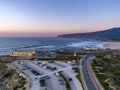 Aerial dronephoto of Praia do Guincho Beach and Hotel Fortaleza at sunset in Sintra, Portugal