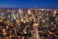 Aerial evening view of Midtown New York City skyline along Fifth Avenue. Illuminated Manhattan skyscrapers