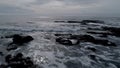 Aerial flight close to surface of ocean towards horizon