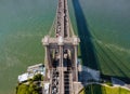 AERIAL flight over Brooklyn Bridge with American flag waving and East River view over Manhattan New York City Skyline Royalty Free Stock Photo